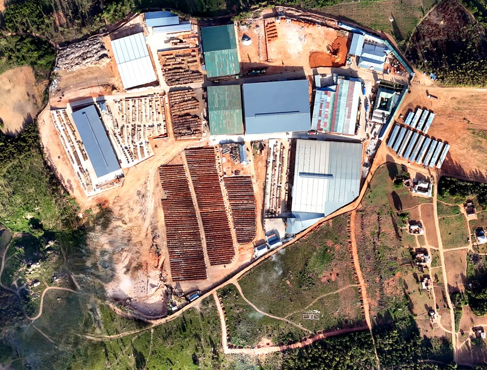 Aerial photograph of the plywood mill, drying yard and charcoal plant