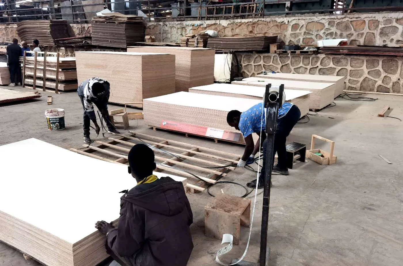 Steel strapping of plywood bundles